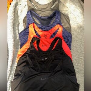 Nike Women's Racerback Tank Tops in Black, Orange, and Blue